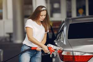 Woman Fuelling car